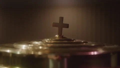 Focusing on a Cross on the Lid of a Communion Wine Plate Stockbeeldmateriaal 208801843