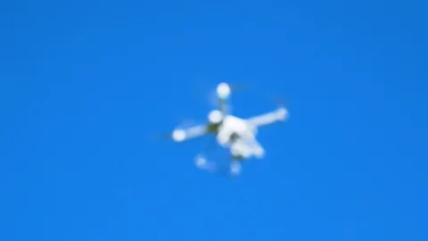 Focusing of a drone with a very blue sky in the background Stock Footage 94230650