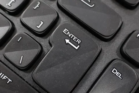 Focusing on "Enter" Key on the Black Keyboard Stock Photos