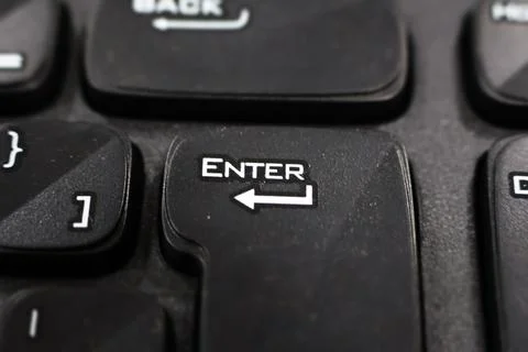 Focusing on "Enter" Key on the Black Keyboard Stock Photos