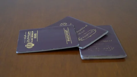 Focusing on iranian passport Stock Footage 125526804