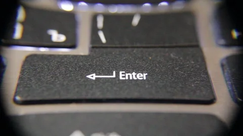 Focusing on the laptop keyboard. The key is Enter. Stock Footage 91330867