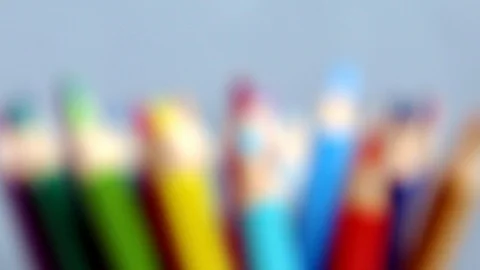 Focusing on multi colored pencils on grey background.  Stock Footage 124634428