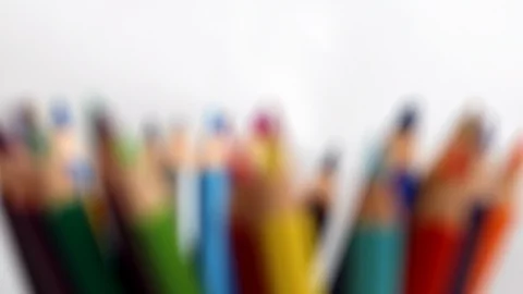 Focusing on multi colored pencils on white background. Close-up front view Stock Footage 124633911