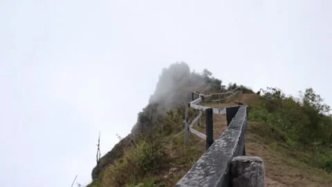 Fog above the mountain top time lapse Stock Footage 154838825