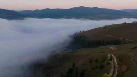 Fog and Clear Hills Divided in Bucovina Drone Shot Stock Footage 290970544