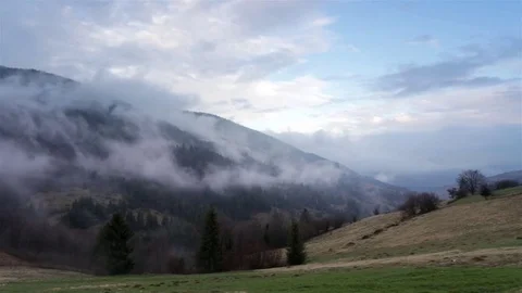 Fog and clouds mountain valley landscape. Evening at mountains range Stock Footage 74837435