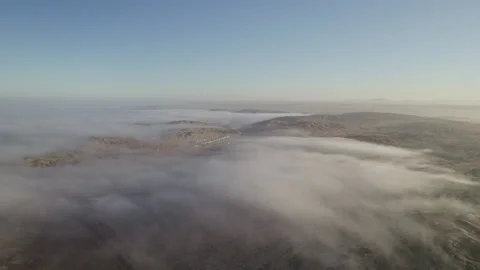 Fog and clouds over the desert in Namibia on a sunset Stock Footage 264601890