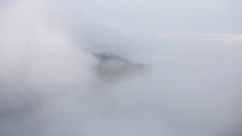Fog and clouds over mountains ridge landscape. Timelapse footage. Stormy weat Stock Footage 121198650