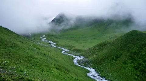 Fog and clouds rolling over mountain green valley and winding River in Kavkaz 스톡 동영상 65775553