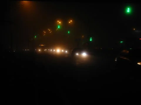 Fog and headlights Stock Photos