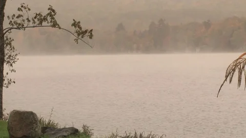 Fog and low clouds over lake Stock Footage 74089095