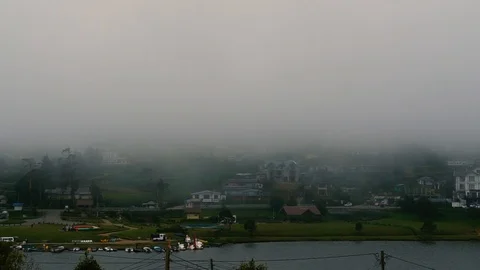 Fog And Low Clouds Over The Mountain Lake - Timelapse Stock Footage 100979914