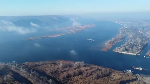 Fog and low clouds over the mountains and the river. Video stock 168180440