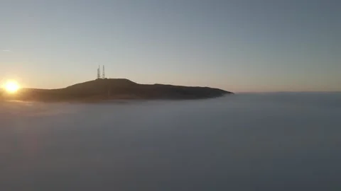 Fog and mountains with sun appearing Stock Footage 336998682