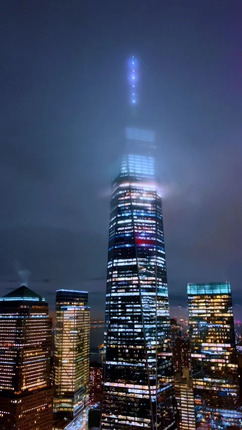 Fog around One World Trade Center at night. One World Trade Center in low clouds Stock Footage 333578572
