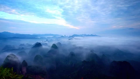 Fog blankets the blue mountain range in a scenic landscape view 스톡 동영상 312304087