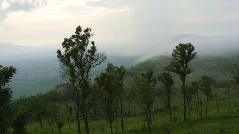 Fog blowing over the hill at Mor Hin Khao Stock Footage 82830967
