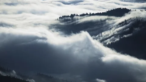 Fog blowing over the hills Stock Footage 121794443
