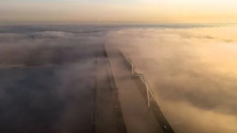 Fog bridge over the Volga river traffic view from the drone Stock Footage 127533231