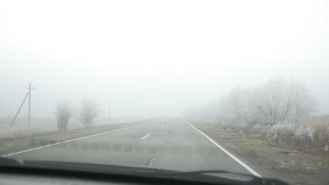 Fog. The car rides at speed on the road in thick fog in morning. Video stock 120108929