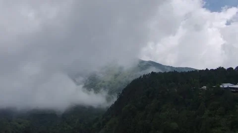 Fog with Cloud Thickness Slowly Covering Mountains Видео 218344397