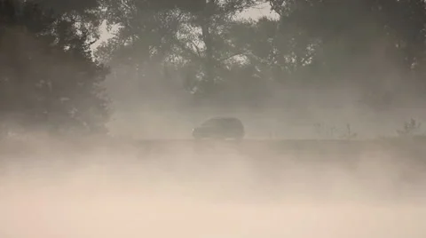 The fog (clouds) above river (lake) and car on the bank, morning Stock-Footage 41793833