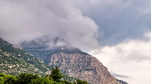 Fog clouds moving timelapse over mountain cliff Magganitis, Ikaria Greece Video stock 282928571