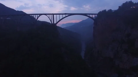 Fog clouds Tara river canyon rocks Montenegro nature old arch bridge Aerial 4k   Stock Footage 76639360