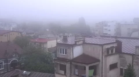 Fog Coming Down Over The Buildings  In The Middle Of The City, Time Lapse Stock Footage 63865452