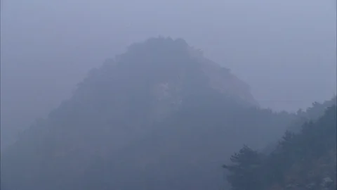 Fog covered mountain ranges Stock Footage 88375044