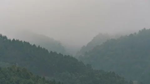 Fog covered mountain in time lapse Stock Footage 140843755