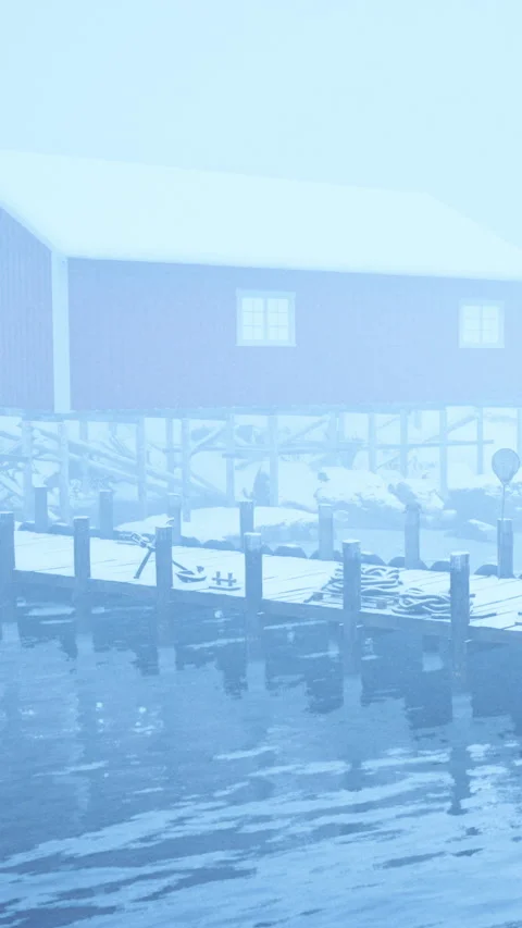 Fog covers a dock and a red building in winter scene near a body of water Stock Footage 338354277