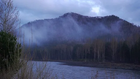 Fog covers mountains and forest with river in the evening time-lapse 스톡 동영상 89202237
