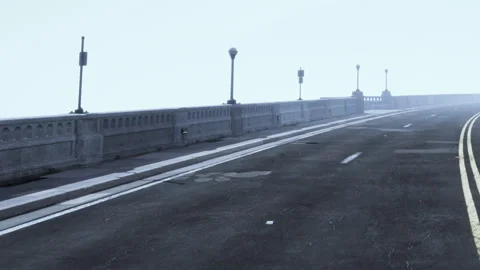 Fog covers a street with empty bins and light posts along the road Stock Footage 345060680