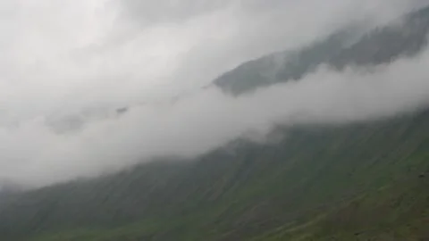 Fog Crawling On The Mountainside. Stock Footage 99140861