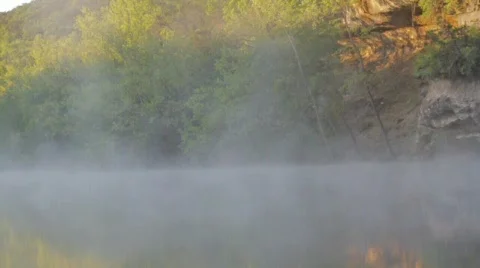 Fog Dancing Across the River During Dawn Stock Footage 750468
