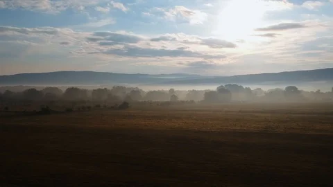 Fog at dawn at the foot of the mountains Stock-Footage 96092713
