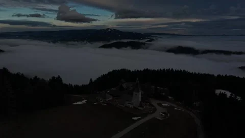 Fog drifting across mountain ridges at dusk Stock Footage 328493798
