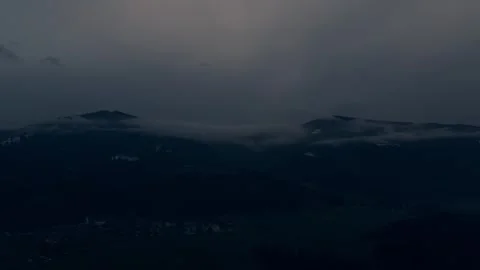 Fog drifting over dark mountain valley Stock Footage 328338111