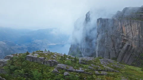 Fog drifting over Pulpit Rock Preikestolen above Lysefjord Norway. Stock Footage 328131378