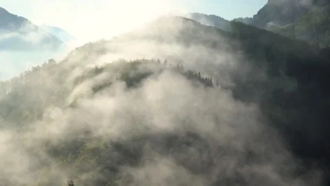 The fog is drifting over the ridge in the Alps Stock Footage 277113827