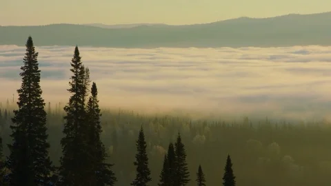 The fog fell below the mountains, the time-lapse at dawn Stock Footage 83010287