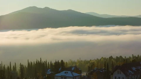 The fog fell below the mountains, the time-lapse at dawn Stock Footage 83011243