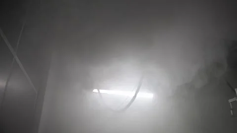 Fog filling an interior space during a climate system test, creating a dense Stock Footage 336688728