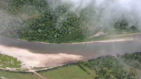 The fog flies over the river Stock Footage 137969285