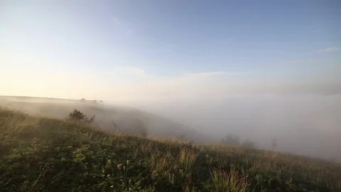 Fog floating over hills Stock Footage 100638216
