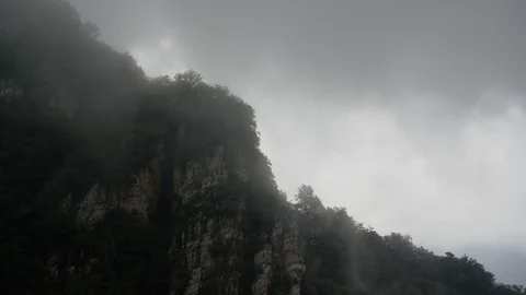 Fog flow among mountains Stock Footage 93492210