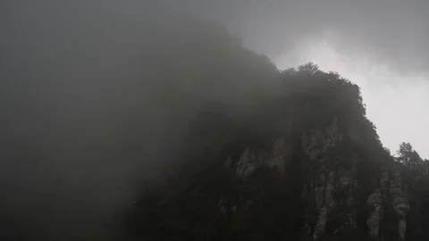 Fog flow among mountains Stock Footage 93492249