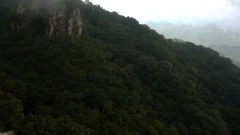 Fog flow among mountains Stock Footage 93492405